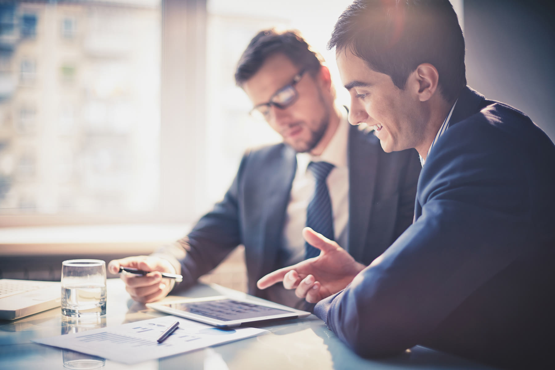 Business meeting around a conference table